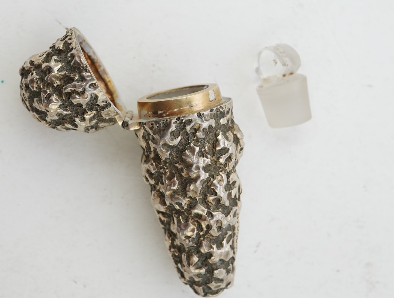 A late Victorian novelty silver scent flask, modelled as a 'gold nugget' by George Ward